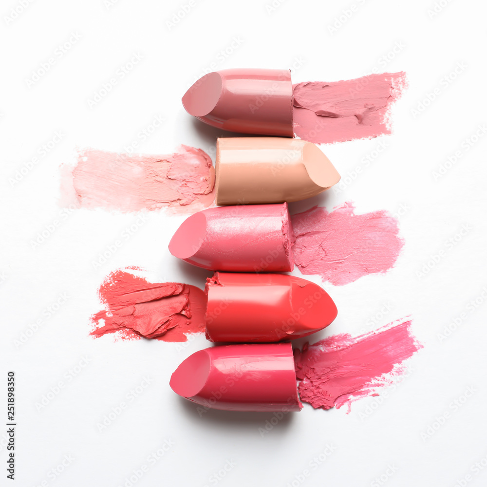 Different lipstick swatches on white background, top view - obrazy, fototapety, plakaty 