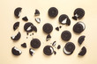 Tasty chocolate cookies with cream on color background, flat lay