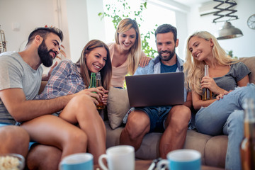 Poster - Friends watching football game on laptop