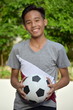 © dtiberio - Happy Filipino Person With Soccer Ball