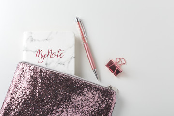 Wall Mural - Glitter bag with pen and planner on white desk