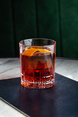 Wall Mural - Negroni cocktail on marble table. With space for your text