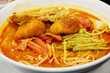 Curry Mee noodles with spicy curry soup with dried tofu, Malaysia cuisine