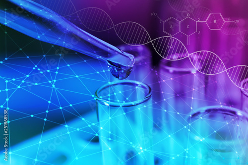 Pipette dripping sample into test tube on color background, closeup