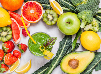 Wall Mural - Fruits and vegetables smoothie glass.Green detox beverage top view on white marble table.