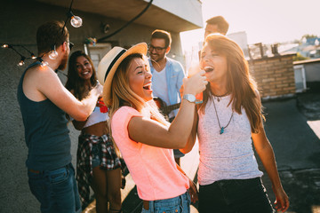 Happy young girls having fun at party