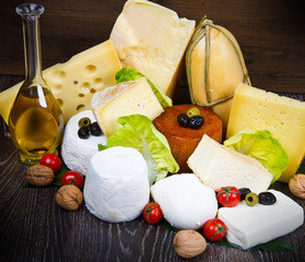 Wall Mural - mixed fresh cheese on wooden board