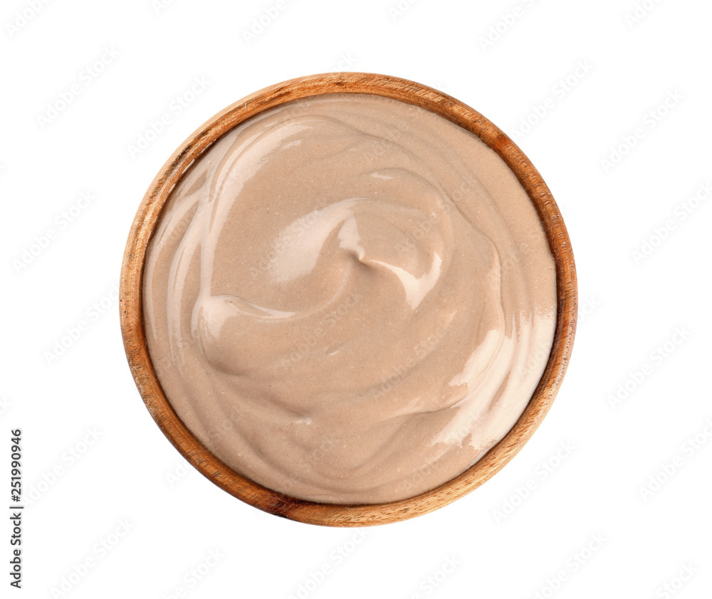 Bowl with chocolate yogurt on white background
