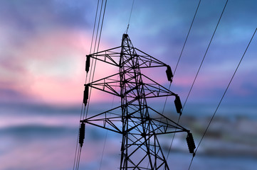 High voltage pole on blue sky background