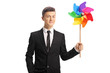 © Ljupco Smokovski - Young guy in a suit with a colorful pinwheel