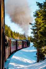 Steam Train In Winter Snowy Landscape At National Park Harz Germany