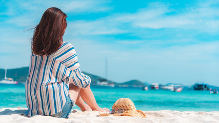 Happy young woman enjoy summer vacation on the beach, Phuket island in Thailand.