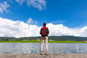 woman hiking at a lake