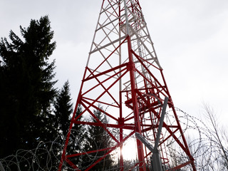 Radio tv radio communication. Communication tower in the forest close up.