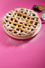 Wall Mural - Plum pie on pink backdrop