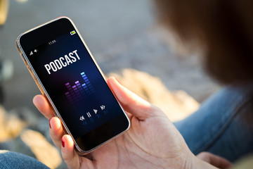 woman sitting in the street listening podcast