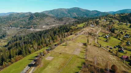 Aufkleber - drone flies over the road in the highlands daytime in autumn season