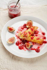 Wall Mural - Breakfast crepes with berry sauce