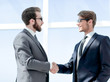 © ASDF - two business people shaking hands