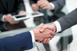 © ASDF - Business men shaking hands. Closeup.