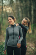 © GAGO IMAGES - Two young beautiful woman exercise in the forest
