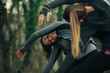 © GAGO IMAGES - Two young beautiful woman exercise in the forest