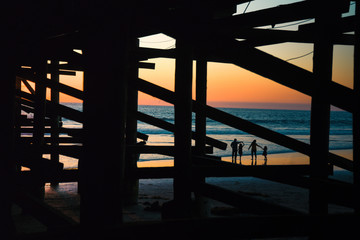 Silhouettes of a family at sunset