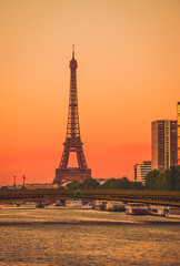 Wall Mural - Sunset view of  Eiffel Tower and river Seine in Paris, France.