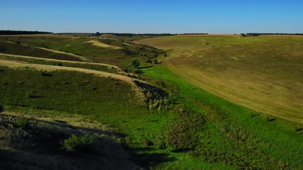Aufkleber - aerial shot view on the rolling hills and field beautiful blue sky autumn season daytime