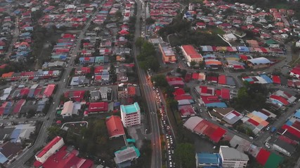 Canvas Print - Aerial Footage of residential housing at Kota Kinabalu city with car moving on the road, Kota Kinabalu, Sabah, Malaysia