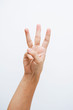 © Windawake - Man hand showing three fingers on white background.