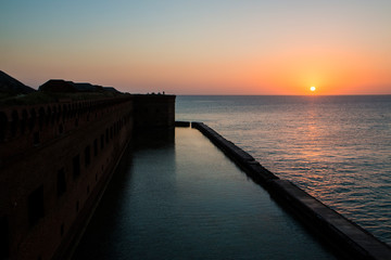 Wall Mural - landscape view of the sunset at fort jefferson in dry tortugas national park (florida).