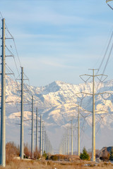 Wall Mural - An Electicity posts against snowy Mount Timpanogos