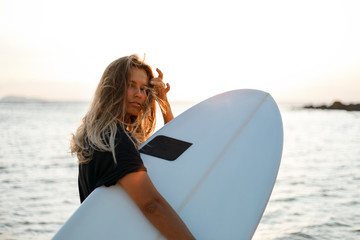 Wall Mural - Surfer girl on beach