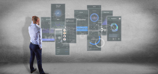 Poster - Businessman in front of a wall with User interface screens with icon, stats and data 3d rendering