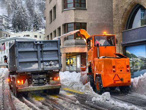Snow Cleaning Tractor Snow Removal Machine Loading Pile Of Snow On A Dump Truck Stock Photo Adobe Stock