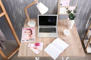 Stylish workplace with modern computer in interior of room