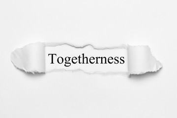 Togetherness on white torn paper