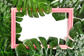 Wall Mural - Creative layout made of tropical leaves with vintage frame.