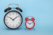 © Tatiana Maramygina - The alarm clock on a color background with free space for text