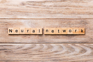 NEURAL NETWORK word written on wood block. NEURAL NETWORK text on wooden table for your desing, concept