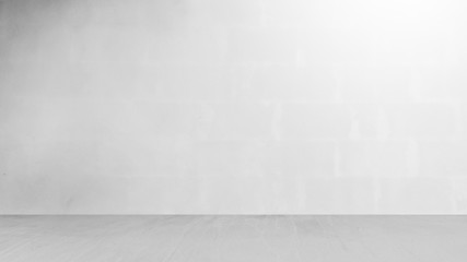 cement wall with floor in the empty room and light for background.