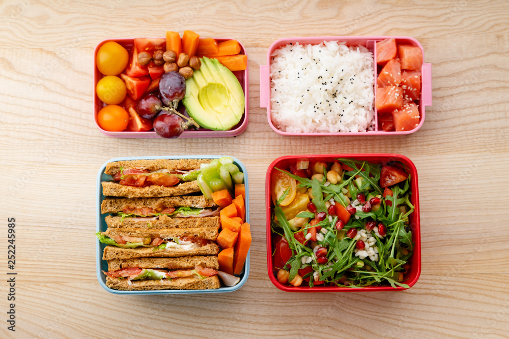 Creative layout with healthy lunch dishes variety in bento boxes on ...