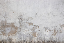 Gray Wall Ruined By Time, Bad Weather And Humidity. Cracks, Mold, Peeling Paint And Plaster. Texture, Material Background.