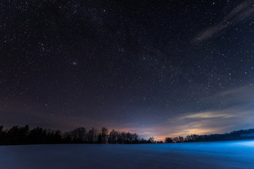 dark sky full of shiny stars in carpathian mountains in winter at night