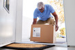 © Monkey Business - Senior Man Coming Back To Home Delivery In Cardboard Box Outside Front Door