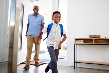 Wall Mural - Grandfather Collecting And Bringing Grandson Home After School