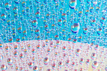 Wall Mural - water drops on dvd media, water drops on colorful background