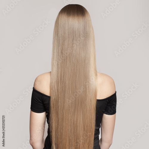 Portrait Of A Beautiful Young Blond Woman With Long Straight