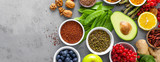 Fototapeta Kuchnia - Healthy food background, spinach, quinoa, apple, blueberry, asparagus, turmeric, red currant, broccoli, mung bean, walnuts, grapefruit, ginger, avocado, almond, lemon  and green peas, top view, banner